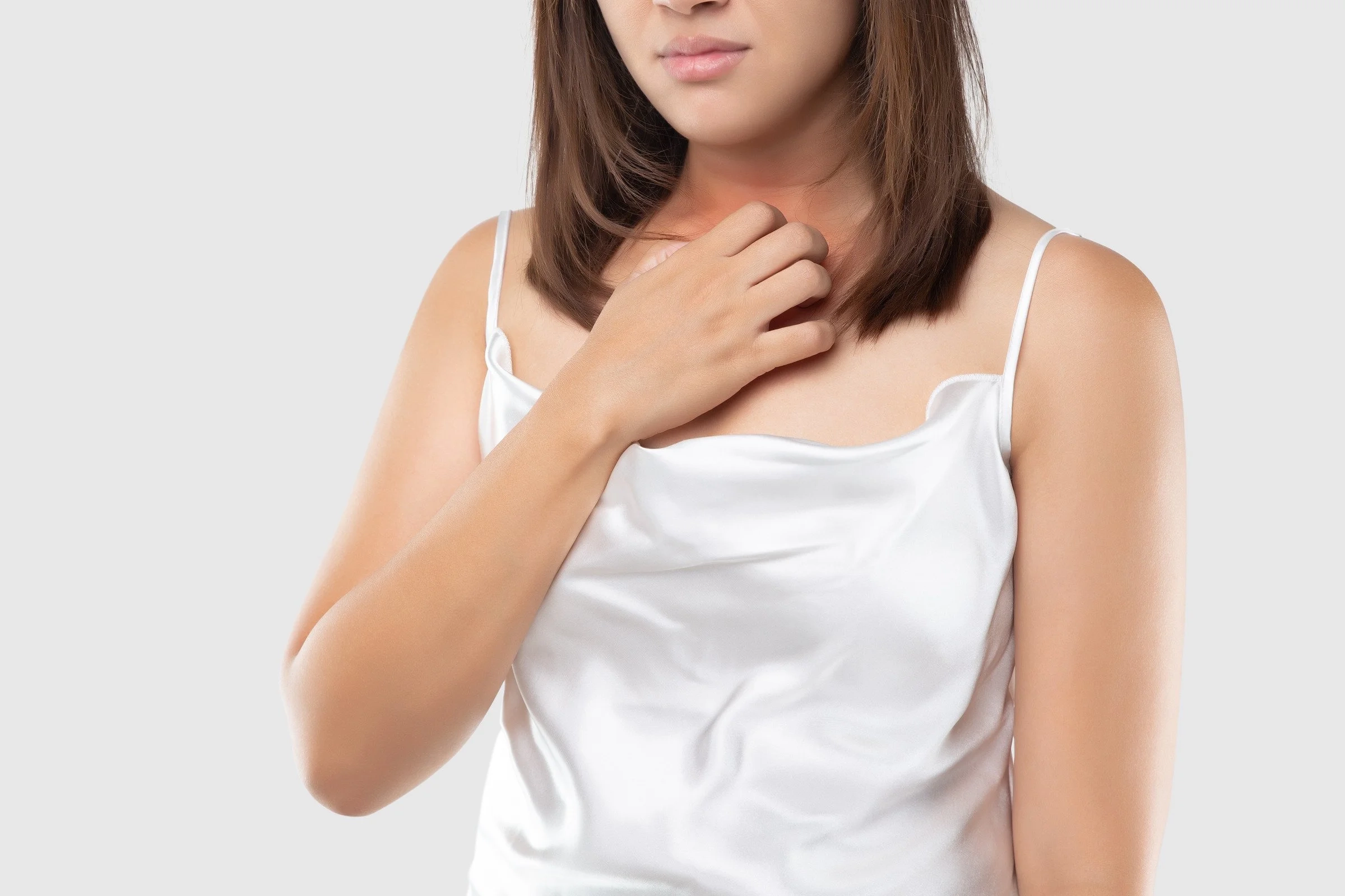 Person touching skin with rash